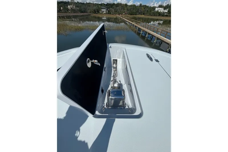 Slide: The Image of 2023 Barker Boatworks 40 HPC anchor compartment with scenic waterway view. - 15