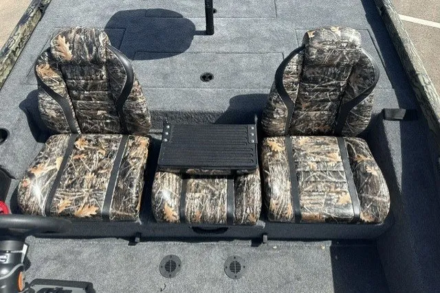 Slide: The Image of 2027 Ranger RT198P boat seats with camouflage upholstery and central console. - 13