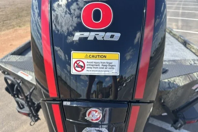 Slide: The Image of 2027 Ranger RT198P boat engine with caution label and red stripes. - 92