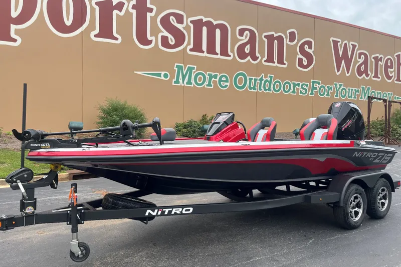 Slide: The Image of 2027 Nitro Z19 XL boat on trailer outside Sportsman's Warehouse. - 2