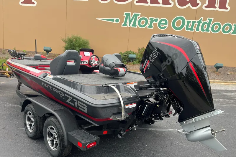 Slide: The Image of 2027 Nitro Z19 XL boat with powerful outboard motor, parked outdoors. - 4