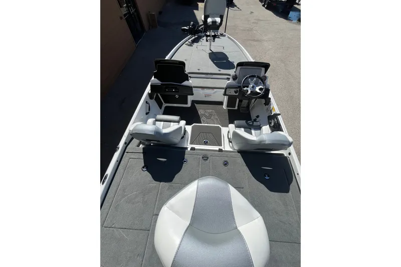 Slide: The Image of 2027 Nitro Z21 XL Pro boat interior with steering console and seating. - 4