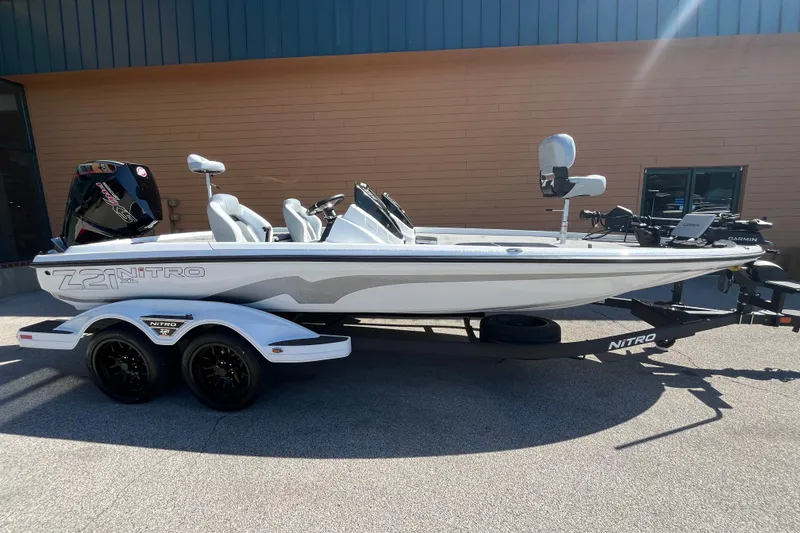Slide: The Image of 2027 Nitro Z21 XL Pro boat on trailer, parked outdoors. - 3