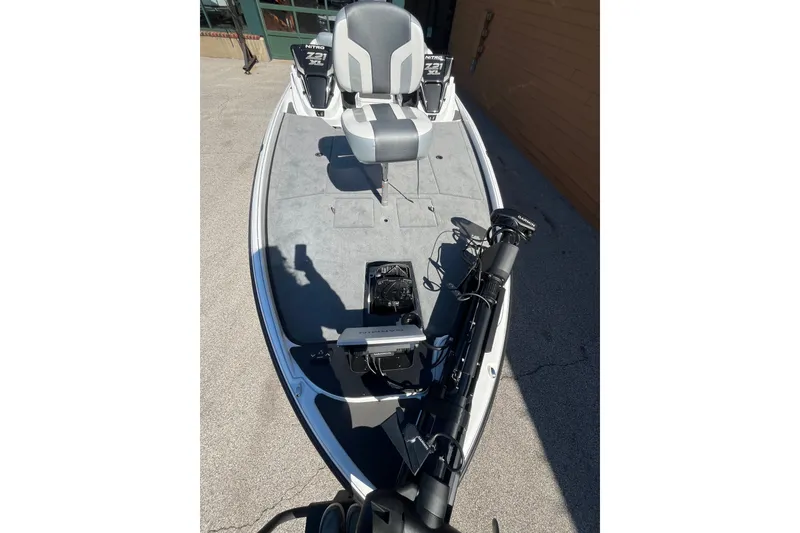 Slide: The Image of 2027 Nitro Z21 XL Pro fishing boat with advanced navigation equipment on deck. - 7