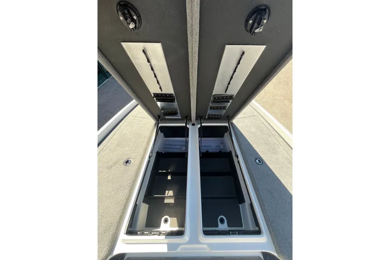 Slide: The Image of Open storage compartments of a 2027 Nitro Z21 XL Pro boat. - 11