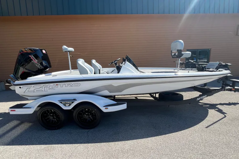 Slide: The Image of 2027 Nitro Z21 XL Pro boat on trailer, parked outdoors. - 2