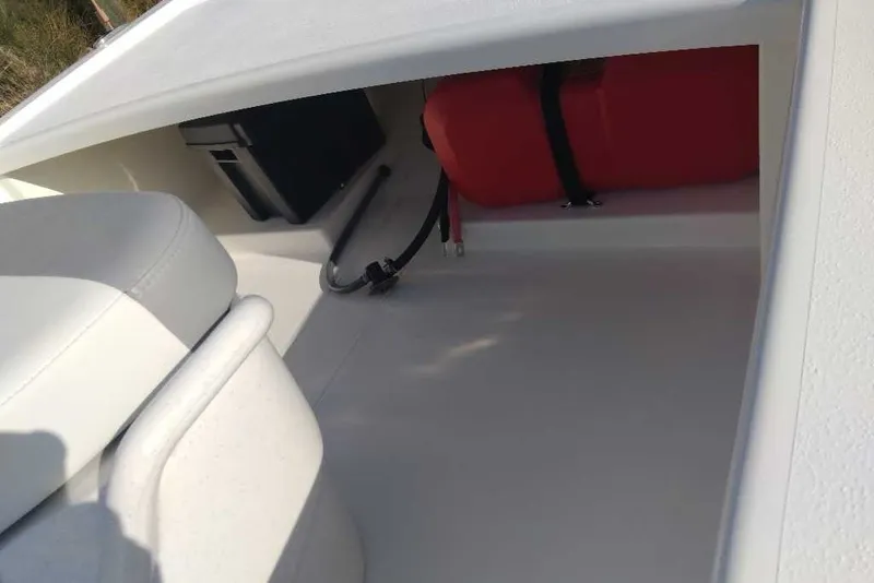 Slide: The Image of Interior view of 2026 Mako Pro Skiff 13 CC boat storage compartment. - 8