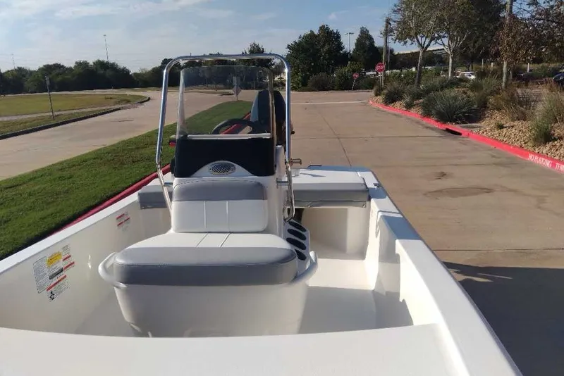 Slide: The Image of 2026 Mako Pro Skiff 13 CC boat parked on a sunny day. - 6