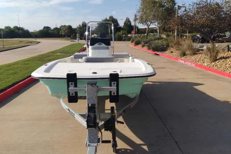 Slide: The Image of 2026 Mako Pro Skiff 13 CC on trailer, parked on a sunny day. - 7