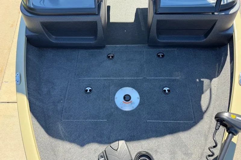 Slide: The Image of Interior view of 2027 Tracker Pro Guide V-16 WT boat deck with carpeted flooring. - 52