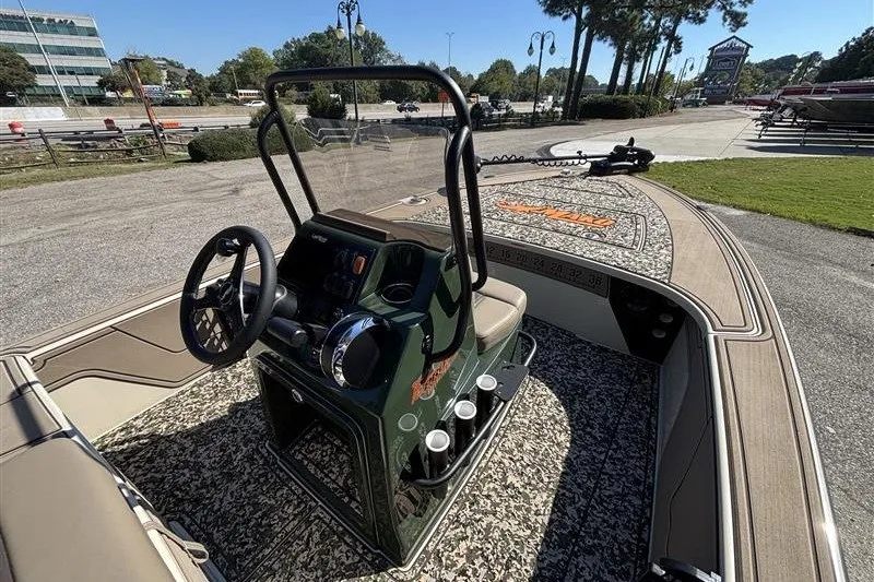 Slide: The Image of 2025 Mako 18 Pro Skiff Backwater Edition boat interior with steering console and seating. - 22