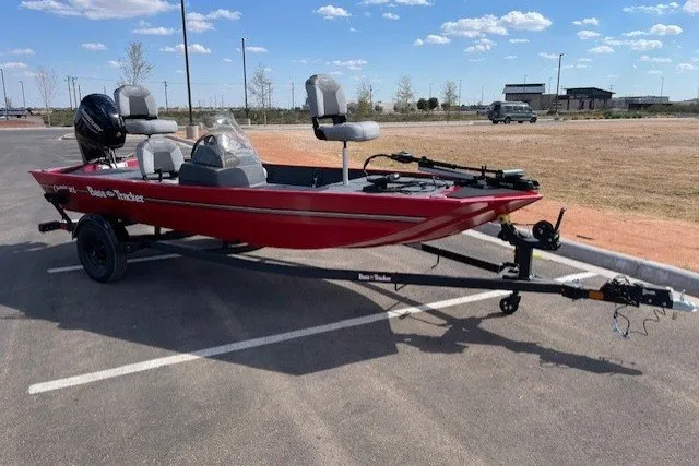 Slide: The Image of 2027 Tracker Bass Tracker Classic XL boat in parking lot under clear sky. - 14