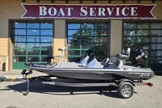 Slide: The Image of 2027 Nitro Z17 boat parked outside a boat service shop. - 1
