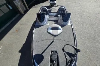 Slide: The Image of 2027 Nitro Z17 fishing boat with dual seats and trolling motor on a sunny day. - 3