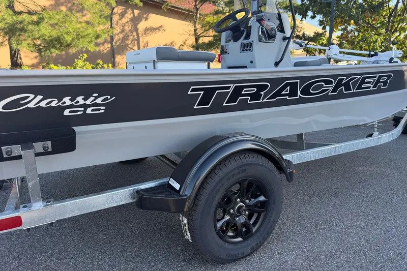 Slide: The Image of 2027 Tracker Bass Tracker Classic CC boat on trailer, side view with logo. - 24