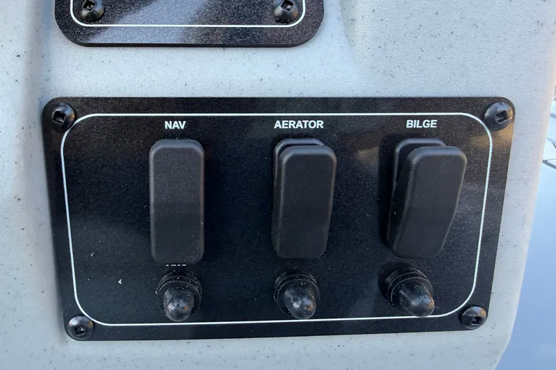 Slide: The Image of Control panel of 2027 Tracker Bass Tracker Classic CC with switches for NAV, Aerator, Bilge. - 25