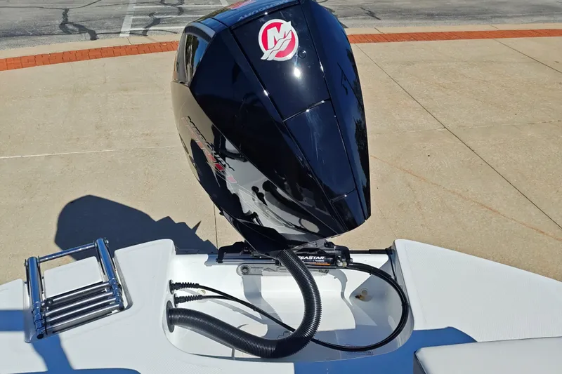 Slide: The Image of 2027 Tahoe T21 boat with a sleek black outboard motor and ladder. - 48