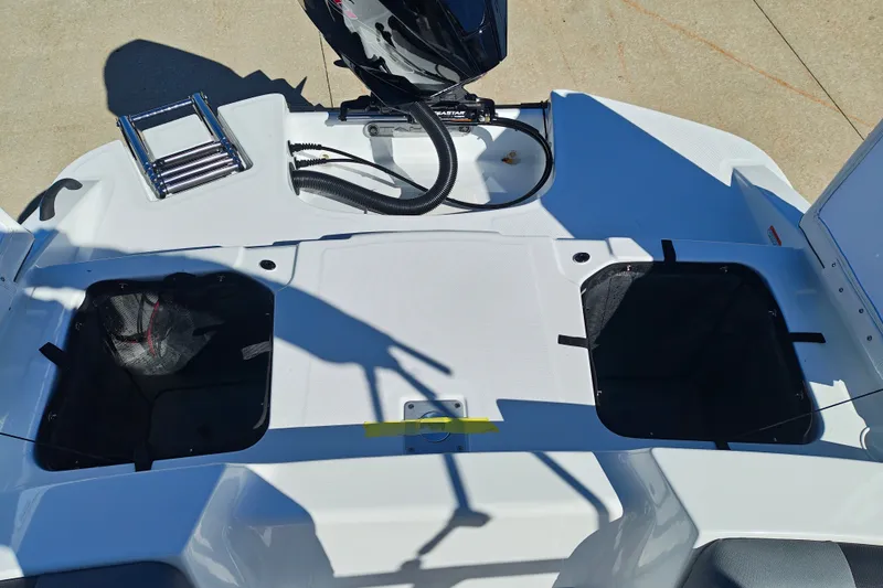 Slide: The Image of Rear view of 2027 Tahoe T21 boat with storage compartments and motor. - 45
