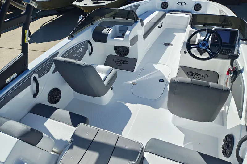 Slide: The Image of 2027 Tahoe T21 boat interior with modern seating and steering console. - 12