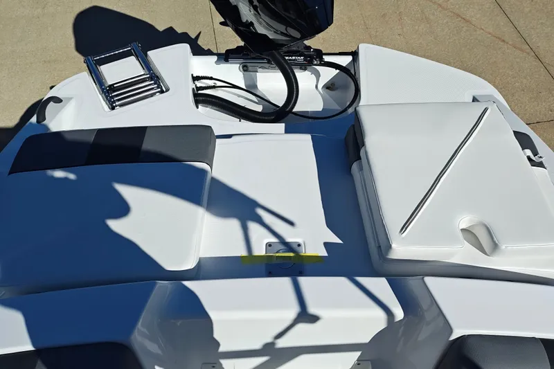 Slide: The Image of 2027 Tahoe T21 boat deck with seating and ladder, featuring sleek white design. - 44