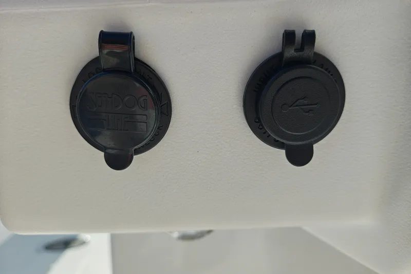 Slide: The Image of Close-up of Tahoe T21 2027 boat's dual USB and power outlets. - 16