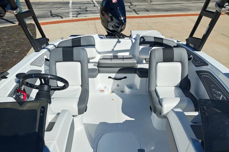 Slide: The Image of Interior of a 2027 Tahoe T21 boat with modern seating and steering wheel. - 37