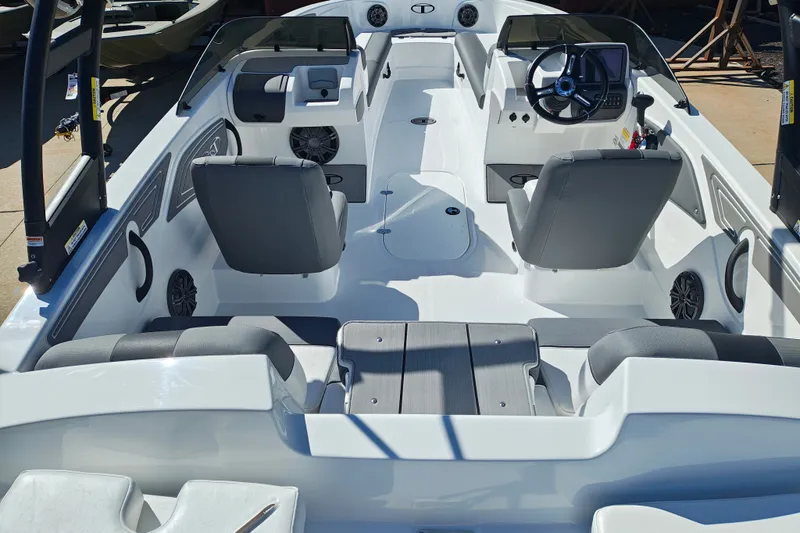 Slide: The Image of Interior view of a 2027 Tahoe T21 boat, featuring modern seating and dashboard. - 10