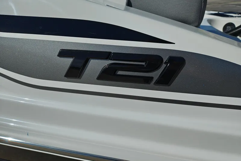 Slide: The Image of 2027 Tahoe T21 boat logo on sleek white and gray surface. - 3