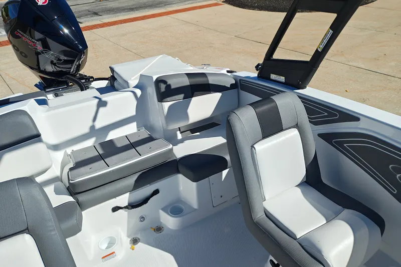 Slide: The Image of Interior of a 2027 Tahoe T21 boat with seating and motor details. - 38