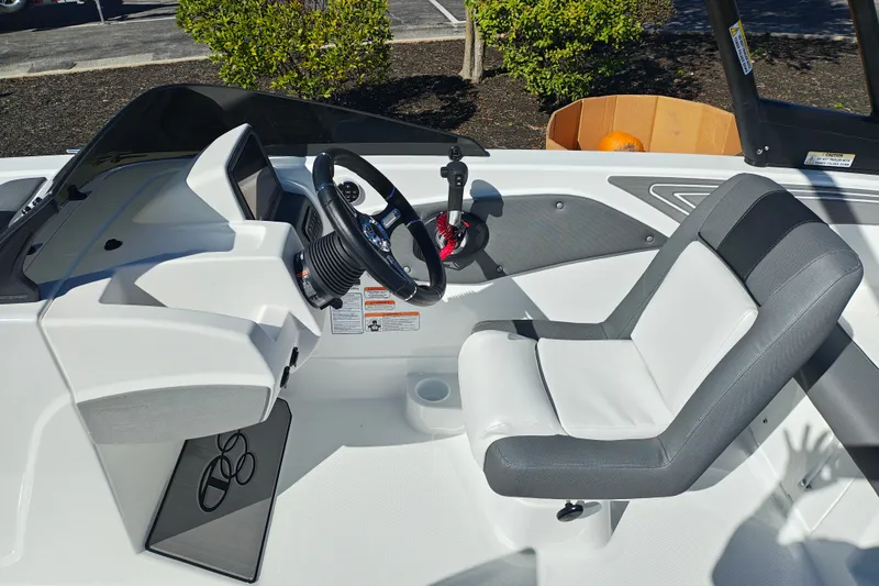 Slide: The Image of 2027 Tahoe T21 boat interior with steering wheel and comfortable seating. - 19