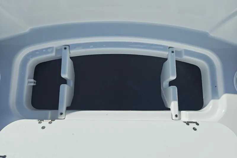 Slide: The Image of Storage compartment on a 2027 Tahoe T21 boat, featuring a sleek white design. - 32