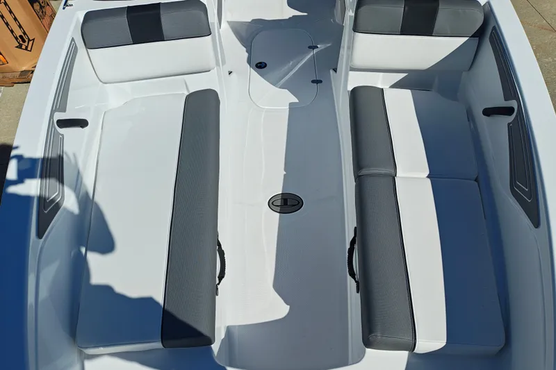 Slide: The Image of Interior view of 2027 Tahoe T21 boat with gray and white seating. - 34