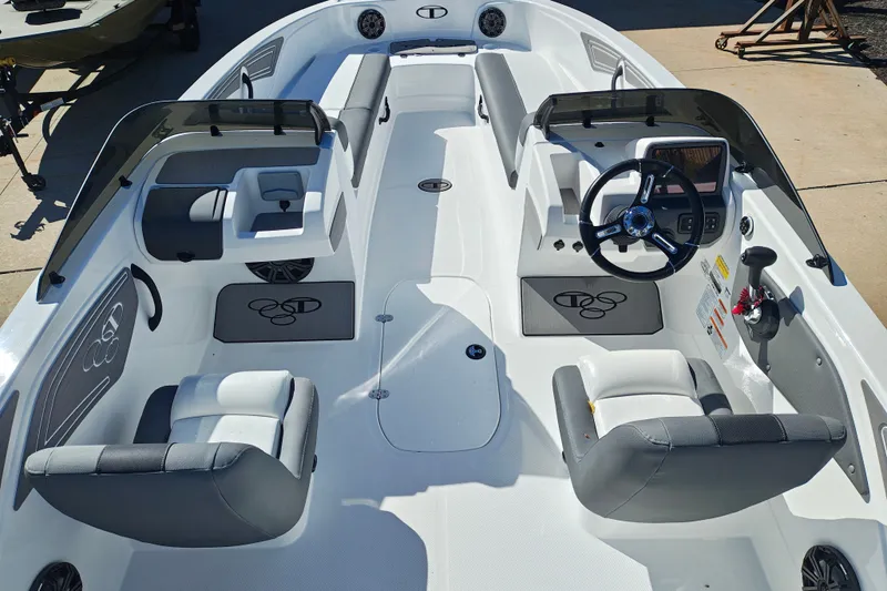 Slide: The Image of 2027 Tahoe T21 boat interior with modern seating and steering console. - 13