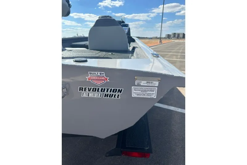 Slide: The Image of 2027 Tracker Pro Team 190 boat with Revolution all-welded hull in a parking lot. - 50