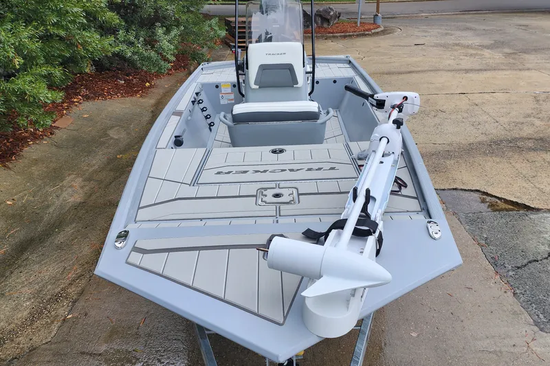 Slide: The Image of 2027 Tracker Bass Tracker Classic CC boat on a concrete surface, featuring sleek design. - 56