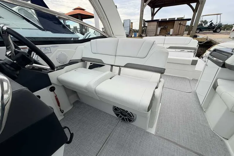 Slide: The Image of 2023 Formula 310 Bowrider I/O interior with luxurious white seating and modern design. - 18