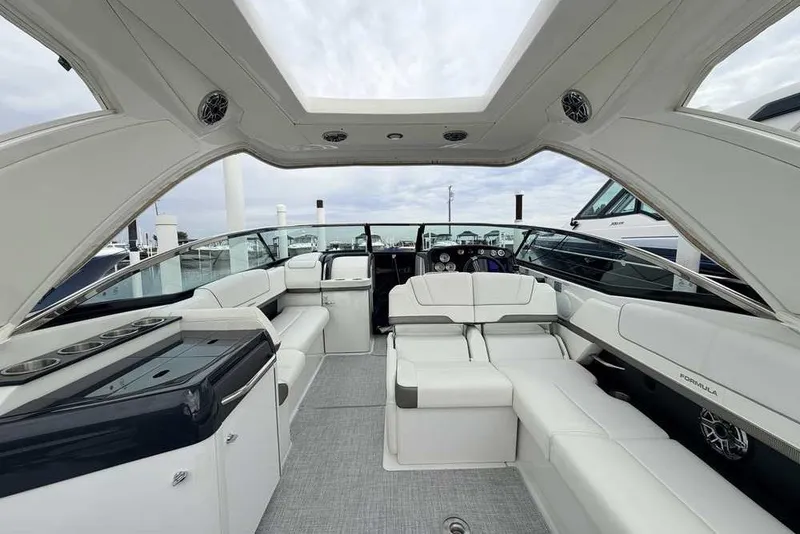 Slide: The Image of 2023 Formula 310 Bowrider I/O interior with luxurious seating and modern design. - 7