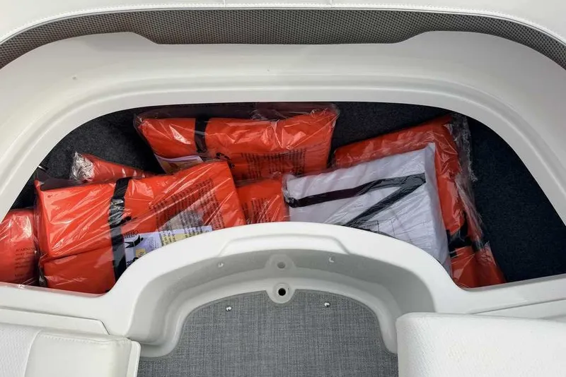 Slide: The Image of Storage compartment of 2023 Formula 310 Bowrider I/O with life jackets. - 33