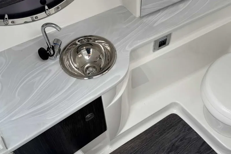 Slide: The Image of 2023 Formula 310 Bowrider I/O interior with sleek sink and modern design. - 14
