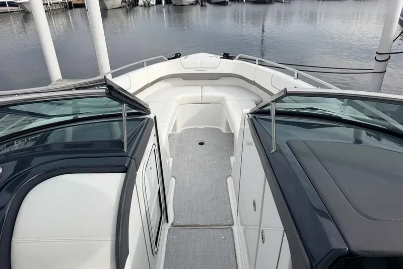 Slide: The Image of 2023 Formula 310 Bowrider I/O boat interior with sleek design at marina. - 26
