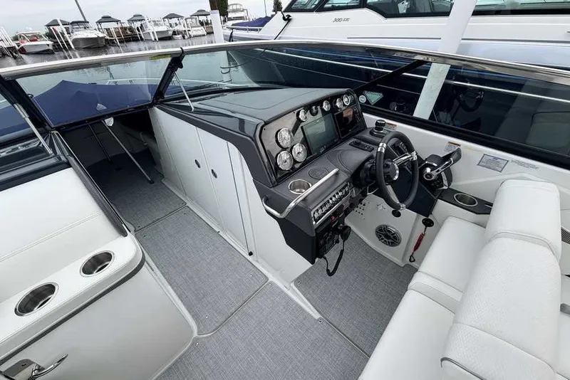 Slide: The Image of 2023 Formula 310 Bowrider I/O cockpit with modern dashboard and luxurious seating. - 20