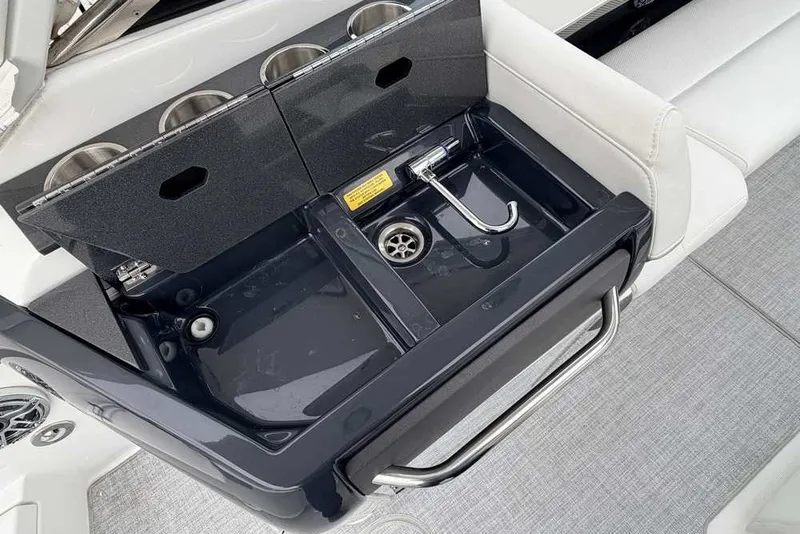Slide: The Image of 2023 Formula 310 Bowrider I/O boat sink with cup holders and sleek design. - 10