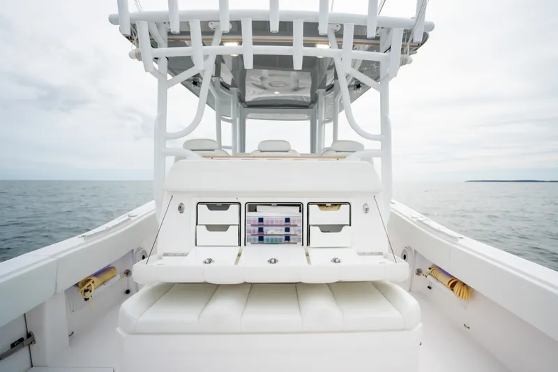 Slide: The Image of 2020 Invincible 39 Open Fisherman boat interior with storage compartments on open sea. - 15