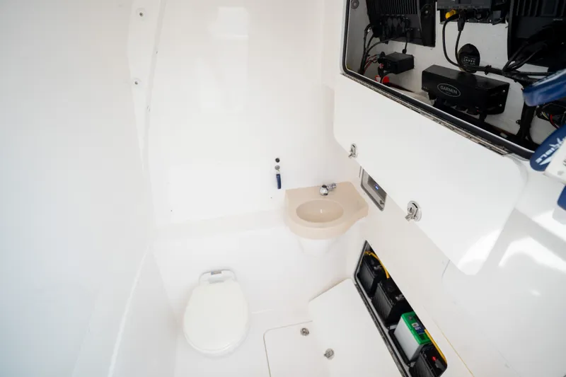 Slide: The Image of 2020 Invincible 39 Open Fisherman boat interior with toilet and sink. - 20