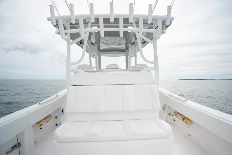 Slide: The Image of 2020 Invincible 39 Open Fisherman boat with white seating on open water. - 14