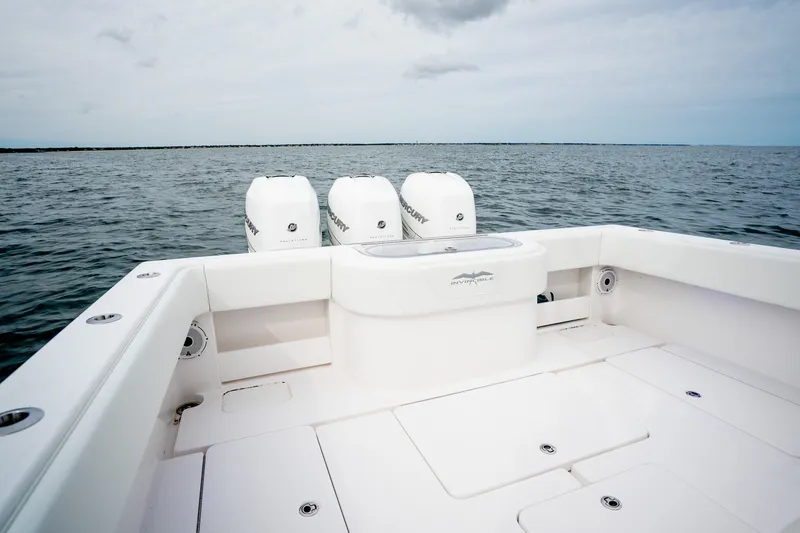 Slide: The Image of 2020 Invincible 39 Open Fisherman boat with triple Mercury engines on open water. - 17