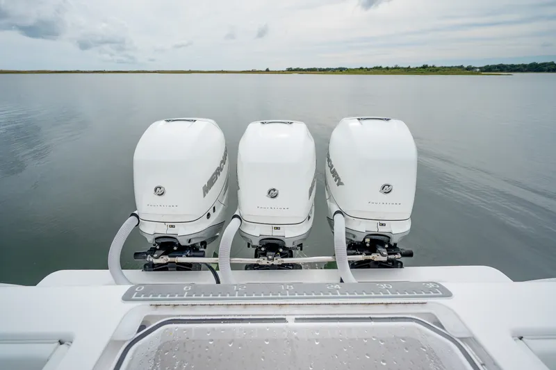 Slide: The Image of Triple Mercury outboard engines on a 2020 Invincible 39 Open Fisherman boat. - 16
