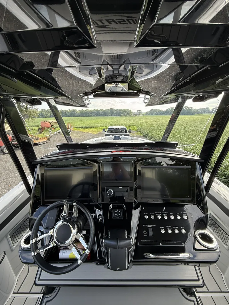 Slide: The Image of The image shows the cockpit of a 2024 Sunsation 32 CCX with modern instruments and a sleek steering wheel. - 8