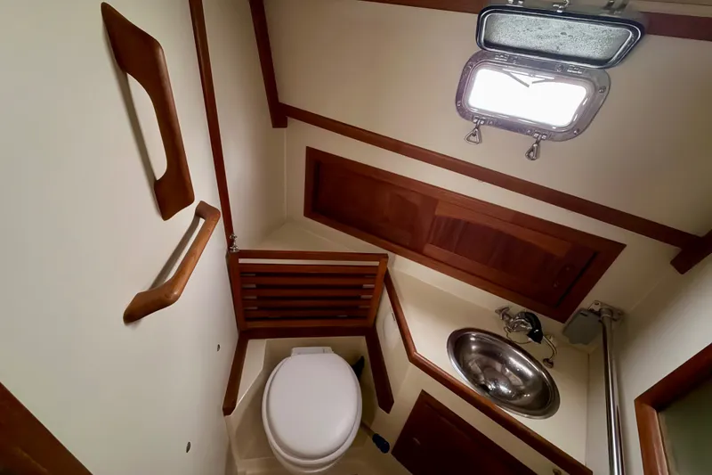 Slide: The Image of Bathroom interior of 1997 Pacific Seacraft Crealock 37 yacht with wooden accents. - 62