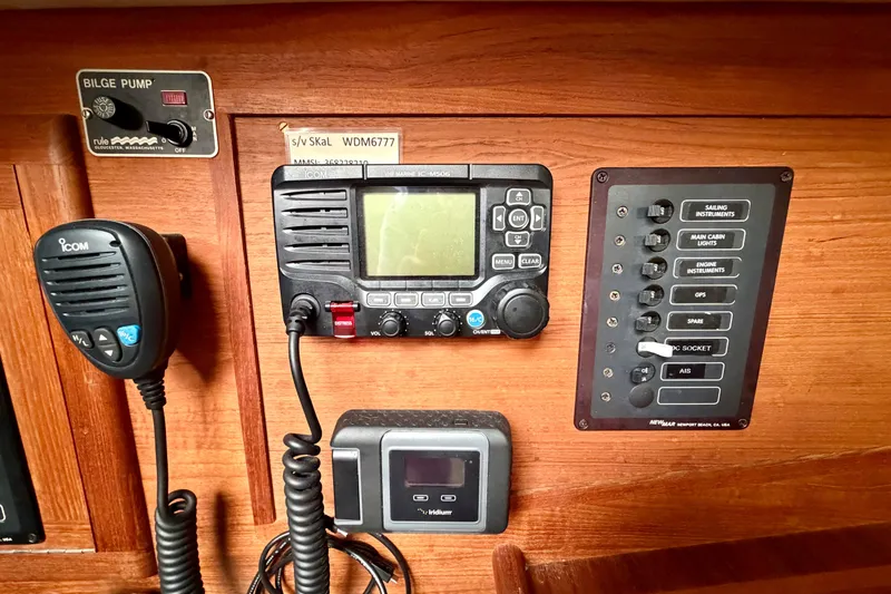 Slide: The Image of Control panel of a 1997 Pacific Seacraft Crealock 37 sailboat with radio and switches. - 18
